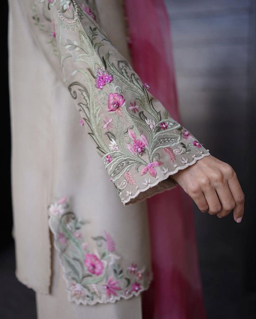 Elegant embroidered sleeve of trendy women's salwaar set showcasing floral patterns and intricate detailing.