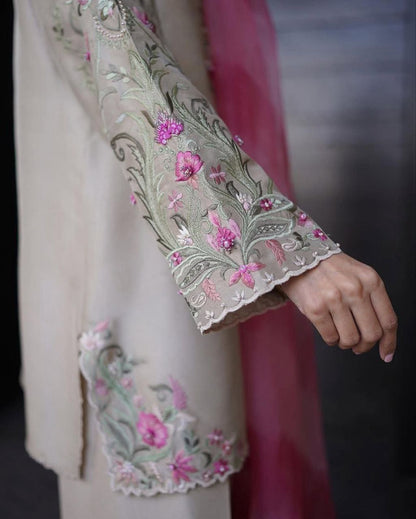 Elegant embroidered sleeve of trendy women's salwaar set showcasing floral patterns and intricate detailing.