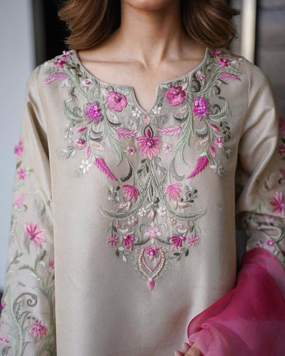 Trendy Women's Salwaar Set featuring intricate embroidery in shades of pink on a beige fabric top.