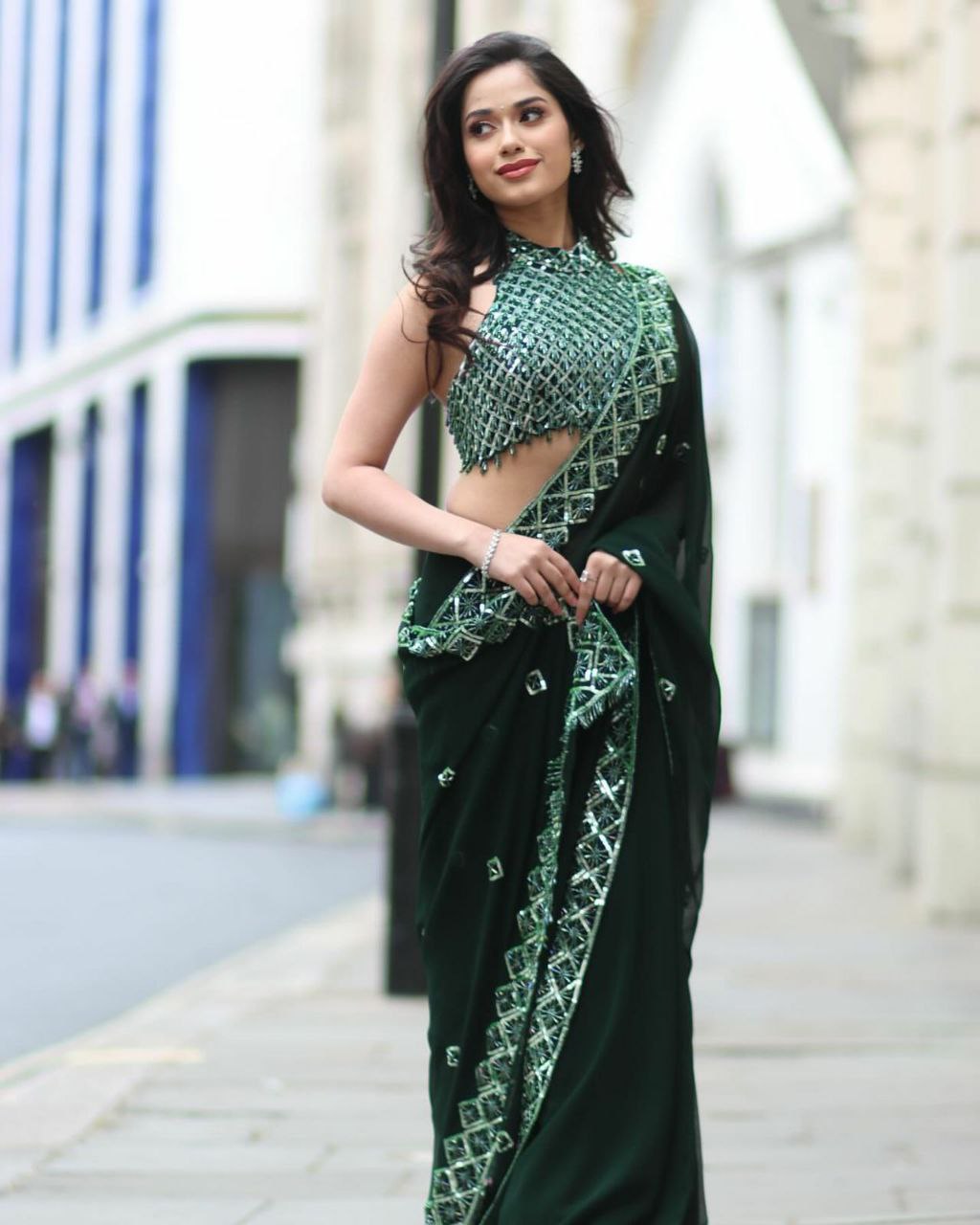 Elegant Soft Rangoli Silk Saree with beautiful sequence embroidery, complementing sequins blouse in rich dark green.
