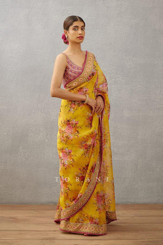 Trendy yellow georgette saree for women with digital floral print and embroidered lace border, styled for elegance.